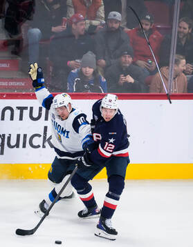 Henri Jokiharju of Finland and Matt Boldy of USA