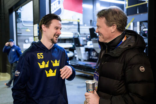 Erik Karlsson of Sweden talks to Johan Garpenlöv, former