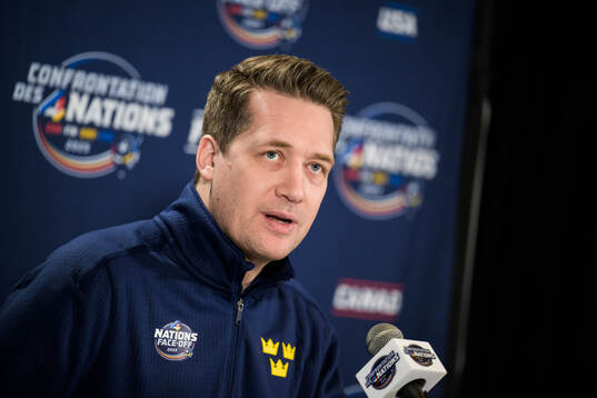 Head coach Sam Hallam of Sweden talks to media