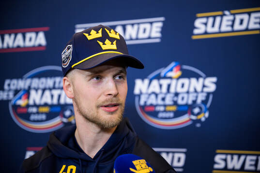 Elias Pettersson of Sweden being interviewed by media