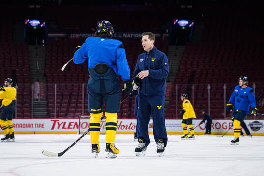 Mika Zibanejad and head coach Sam Hallam of Sweden at a