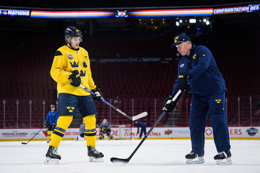 Leo Carlsson and assistant coach Daniel Alfredsson of