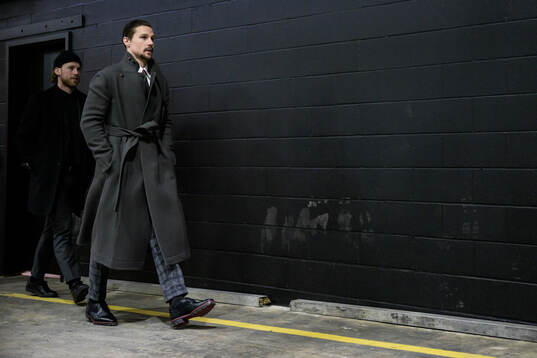 Elias Lindholm and Erik Karlsson of Sweden arrive to the