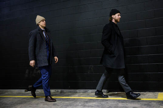 Joel Eriksson Ek and Elias Lindholm of Sweden arrive to the