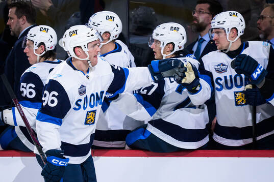 Mikko Rantanen of Finland celebrates with teammates