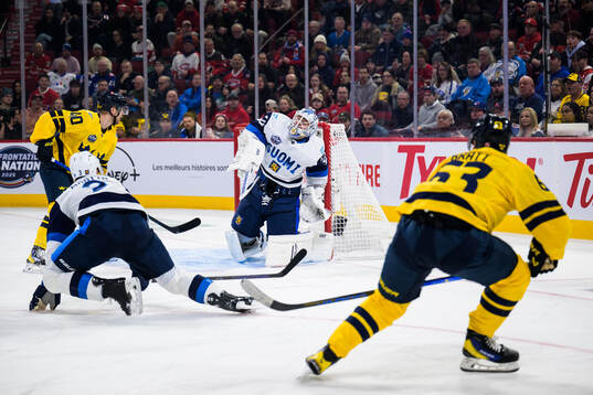 Elias Pettersson and Jesper Bratt of Sweden challenge