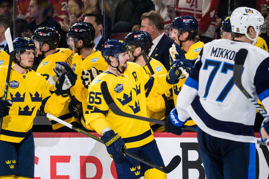 Erik Karlsson of Sweden celebrates with teammates