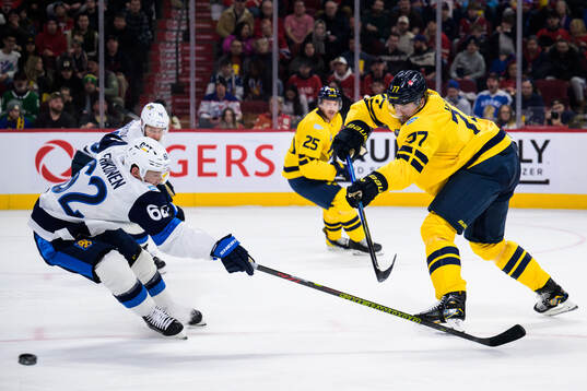 Artturi Lehkonen of Finland and Victor Hedman of Sweden