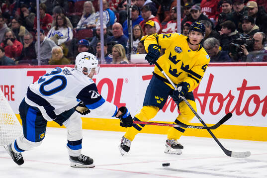Sebastian Aho of Finland and Gustav Forsling of Sweden