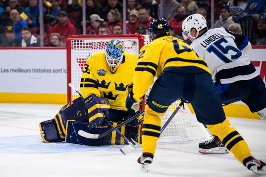 Goaltender Linus Ullmark and Gustav Forsling of Sweden are