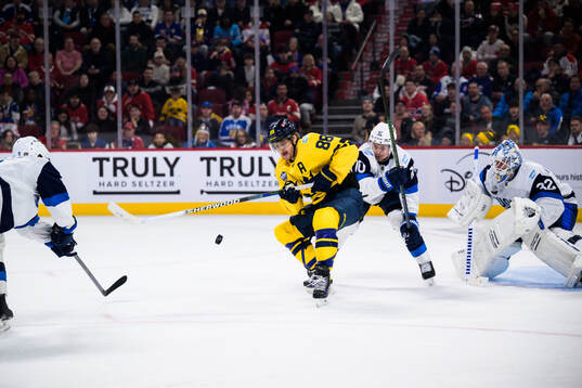 William Nylander of Sweden and Henri Jokiharju of Finland