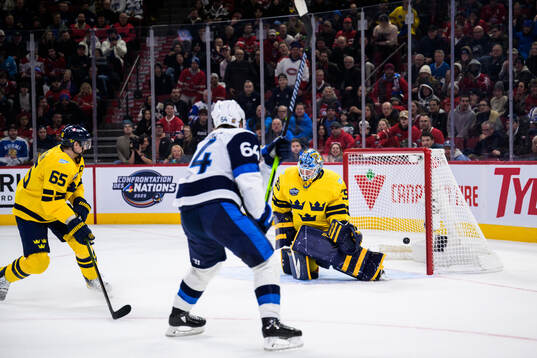 Mikael Granlund of Finland scores the game-winning 3-4 goal