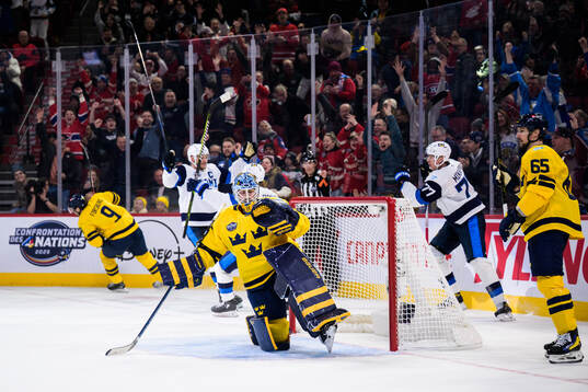 Goaltender Linus Ullmark of Sweden looks dejected