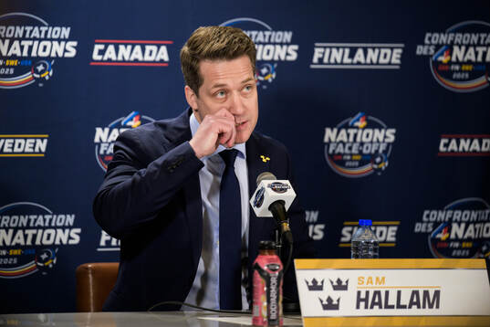 Head coach Sam Hallam of Sweden talks to media