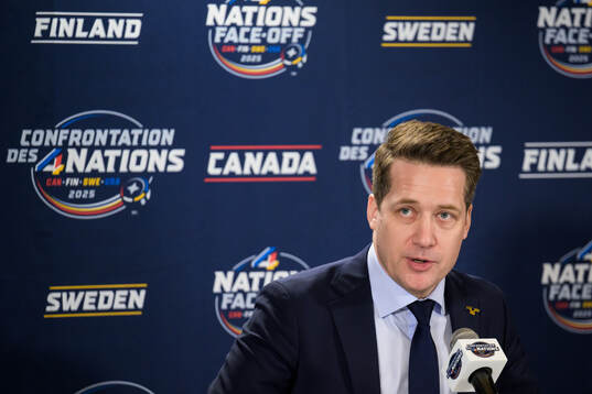 Head coach Sam Hallam of Sweden talks to media