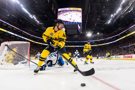 Elias Pettersson and Erik Karlsson of Sweden in action