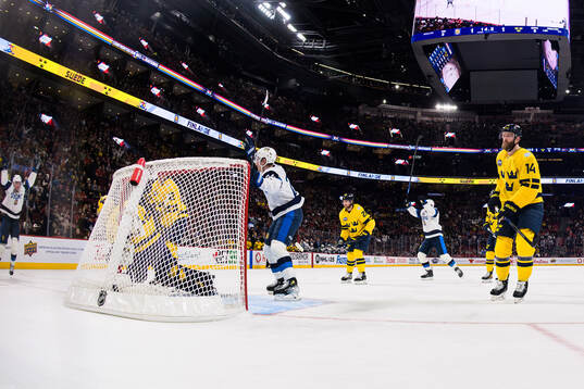 Elias Lindholm and Mattias Ekholm of Sweden look dejected