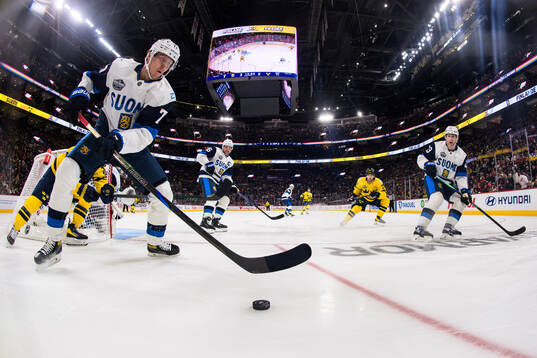Niko Mikkola, Aleksander Barkov and Esa Lindell of Finland