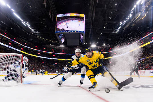 Henri Jokiharju of Finland in action against Viktor