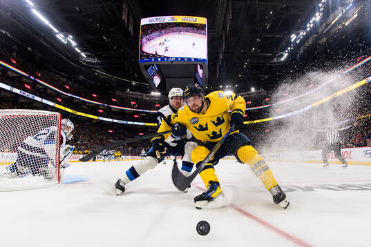 Henri Jokiharju of Finland in action against Viktor