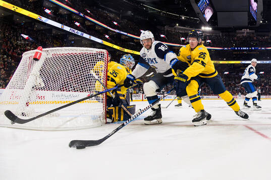 Goaltender Linus Ullmark and Rasmus Dahlin of Sweden are