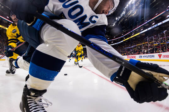 Filip Forsberg and Elias Pettersson of Sweden in action
