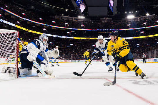 Goaltender Kevin Lankinen and Esa Lindell of Finland are