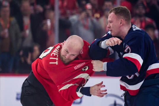 Sam Bennett of Canada and Brady Tkachuk of USA fight