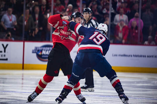 Brandon Hagel of Canada and Matthew Tkachuk of USA fight