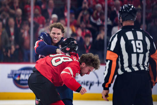 Brandon Hagel of Canada and Matthew Tkachuk of USA fight