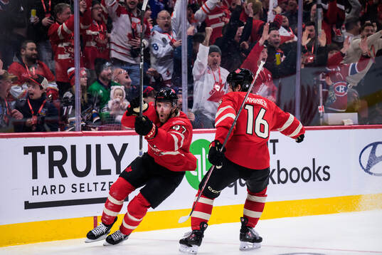 Connor McDavid and Mitch Marner of Canada celebrate the 1-0