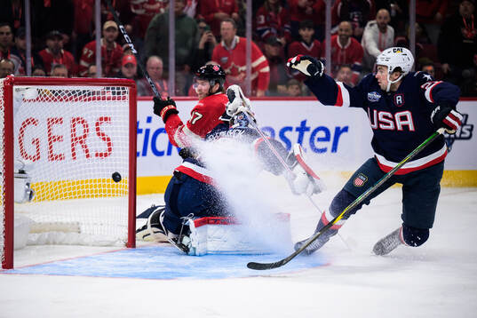 Connor McDavid of Canada scores 1-0 behind goaltender