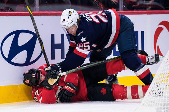 Sidney Crosby of Canada and Charlie McAvoy of USA