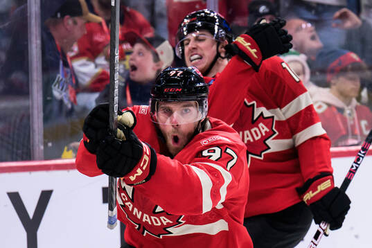 Connor McDavid and Mitch Marner of Canada celebrate the 1-0