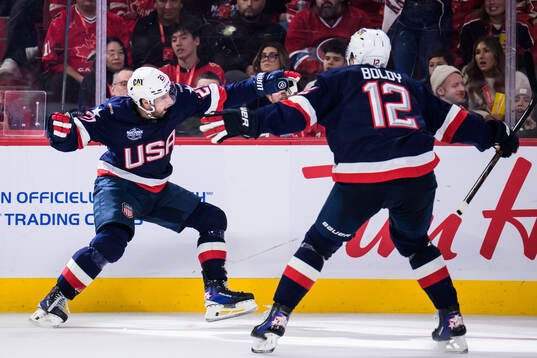 Dylan Larkin and Matt Boldy of USA celebrate the 1-2 goal