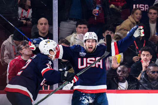 Matt Boldy and Dylan Larkin of USA celebrate the 1-2 goal