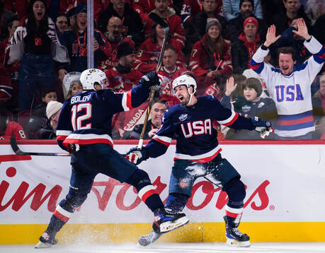 Matt Boldy and Dylan Larkin of USA celebrate the 1-2 goal