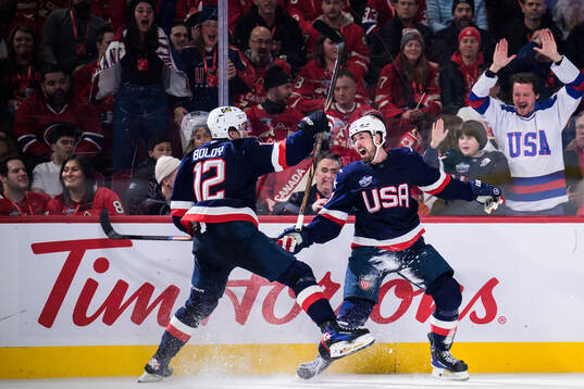 Matt Boldy and Dylan Larkin of USA celebrate the 1-2 goal