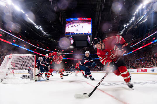 Goaltender Connor Hellebuyck and Brock Faber of USA are