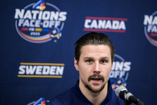 Erik Karlsson of Sweden is being interviewed by media