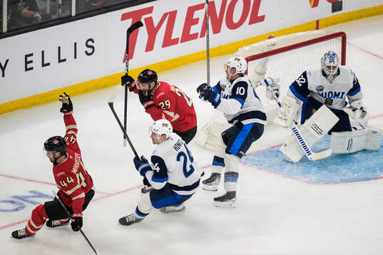 Josh Morrissey and Nathan MacKinnon of Canada celebrate the