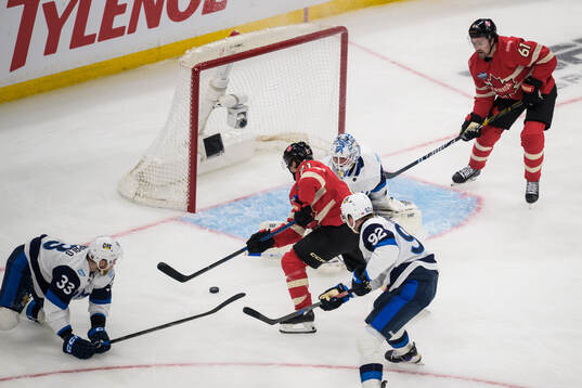 Brayden Point and Mark Stone of Canada challenge Nikolas