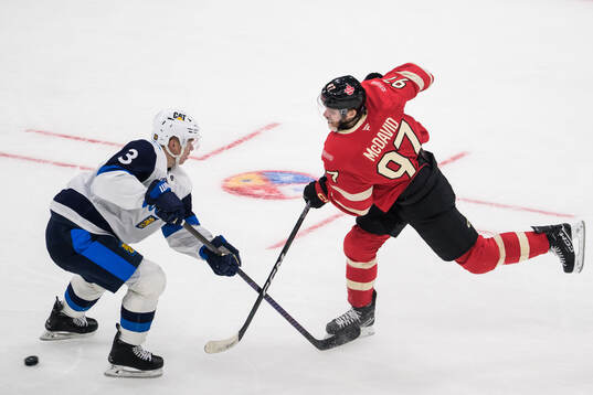 Olli Määttä of Finland and Connor McDavid of Canada