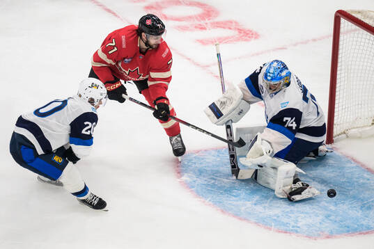 Sebastian Aho and goaltender Juuse Saros of Finland are