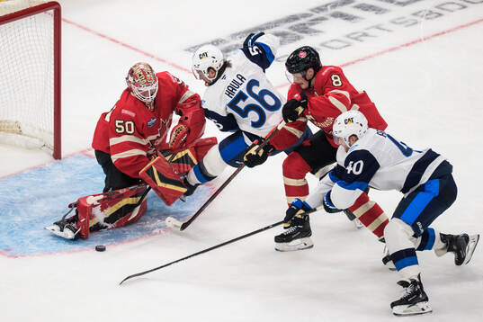 Goaltender Jordan Binnington and Cale Makar of Canada are