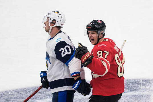 Sebastian Aho of Finland looks dejected when Sidney Crosby