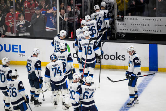 Patrik Laine and his teammates of Finland look dejected