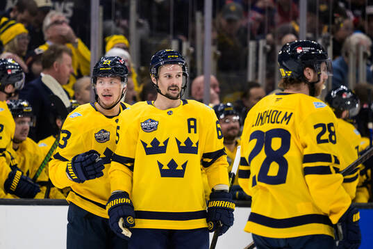 Lucas Raymond and Erik Karlsson of Sweden