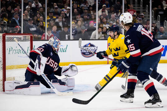 Goaltender Jake Oettinger of USA and Filip Forsberg of
