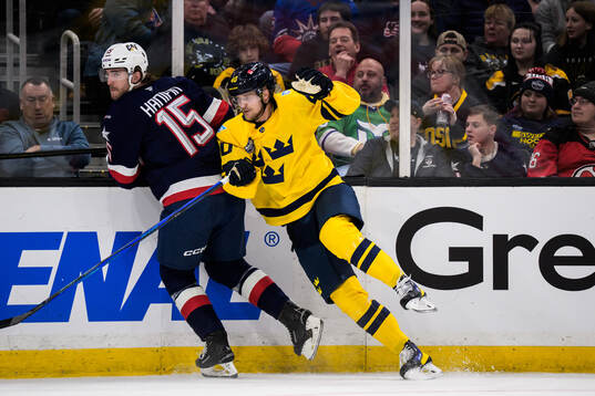 Noah Hanifin of USA and Elias Pettersson of Sweden